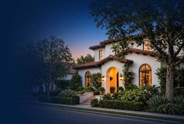 Spanish-style San Gabriel Valley home at dusk with warm lights on — illustrative, not a documented property address
