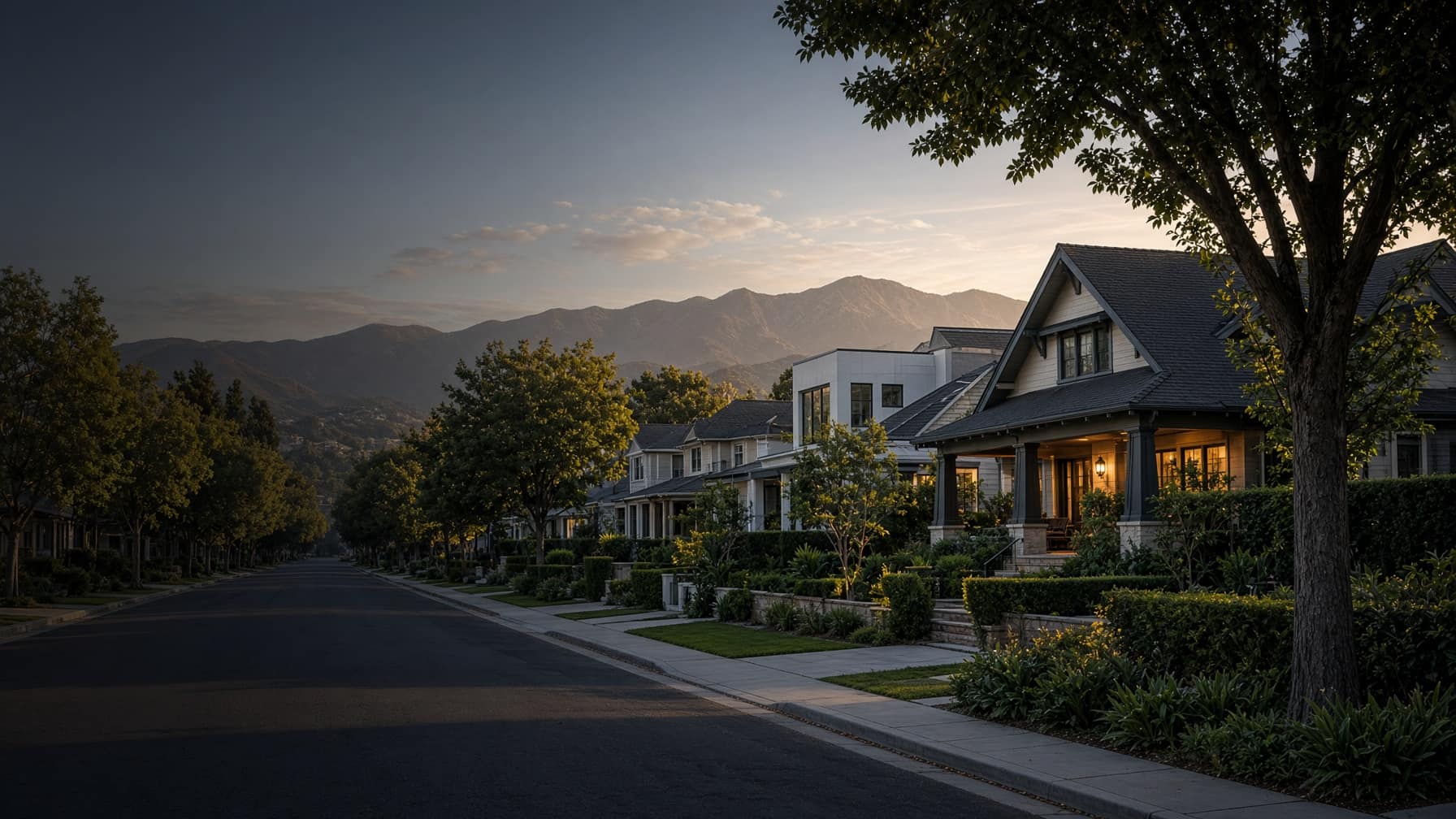 An illustrative residential street at dusk, with mountains beyond — not a documented property address
